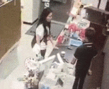 The woman quarrels with the shop assistant, climbs up the counter, pants, urinate, and drinks.,女子与店员争执 爬上柜台脱裤小便然后还喝了下去